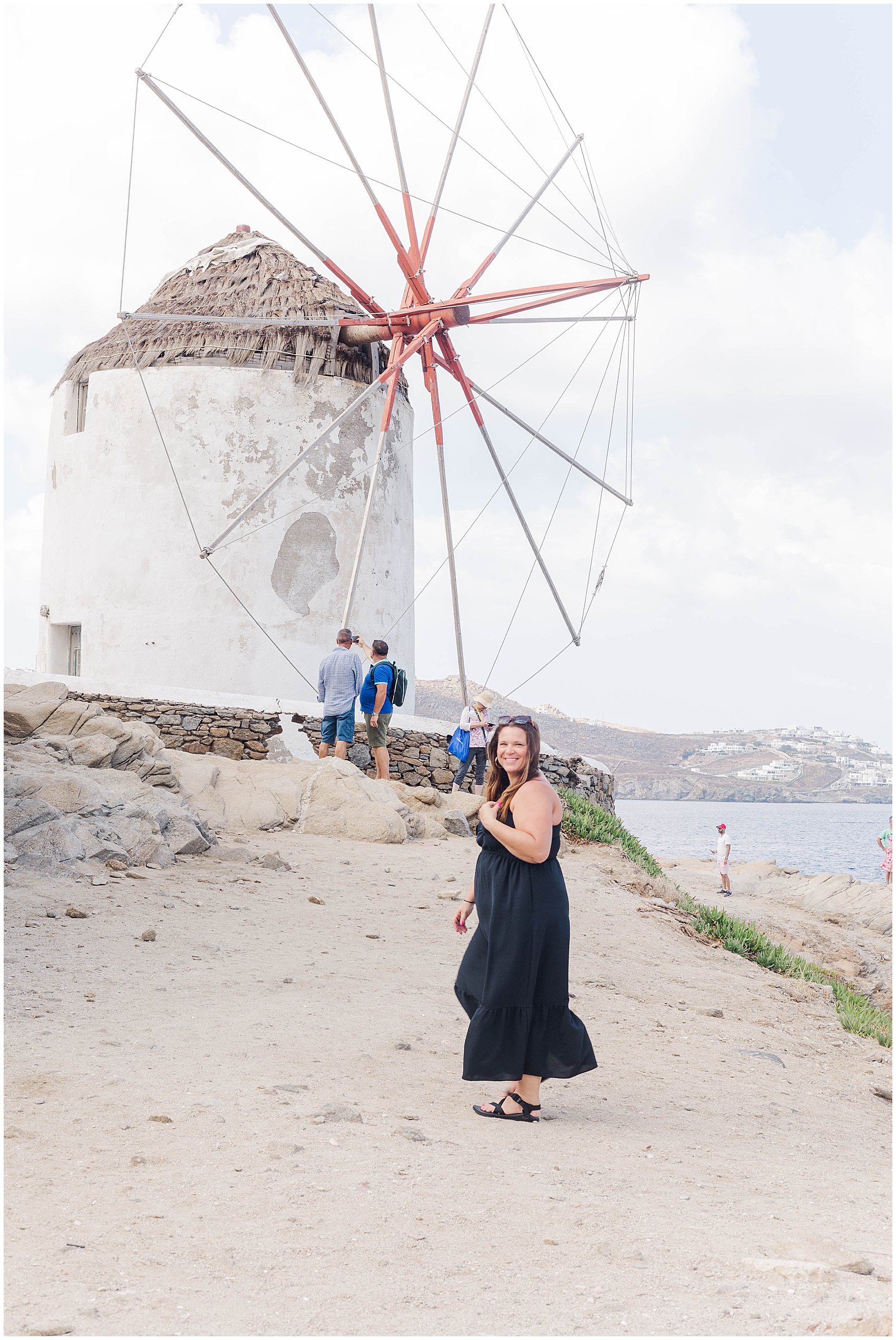 nicole standing in front of a windmill greece photoshoot