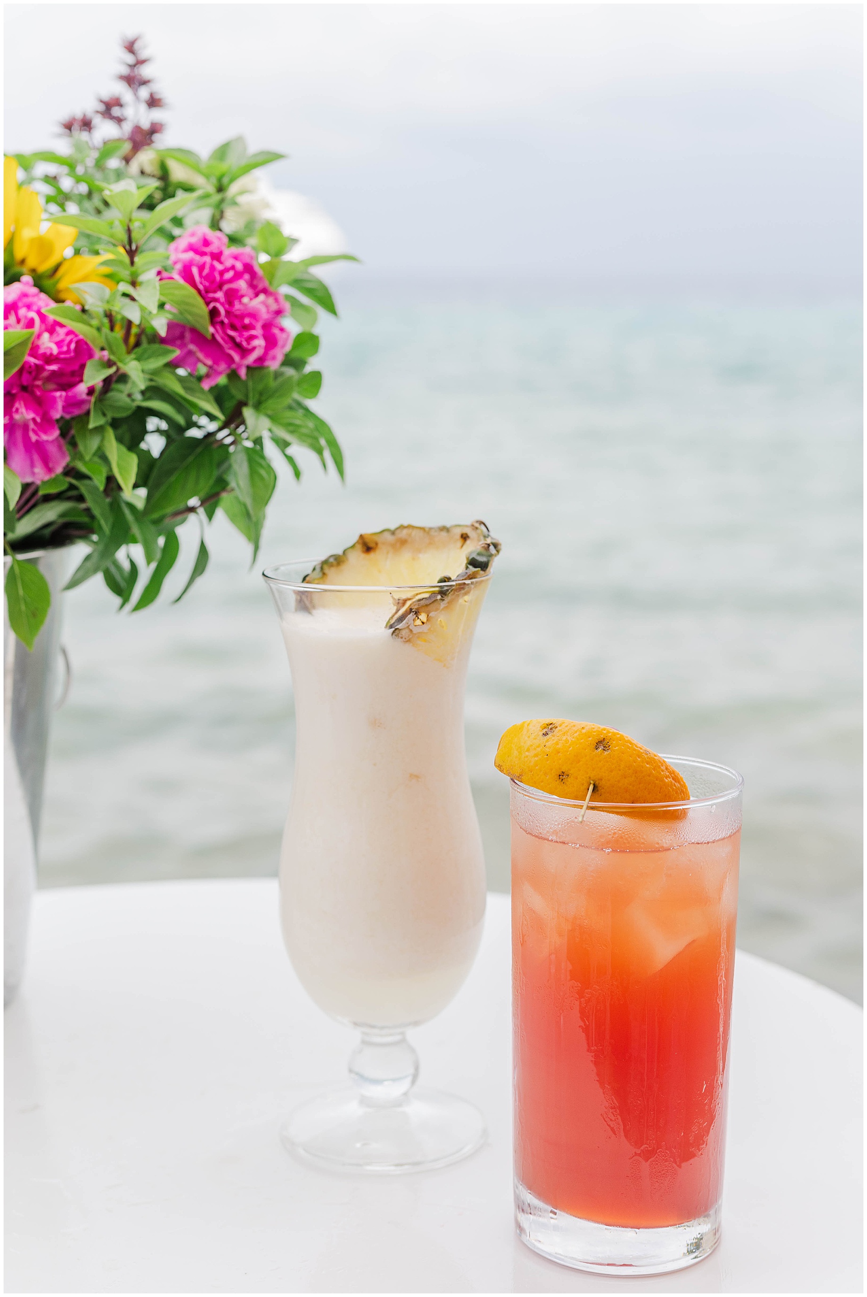 tropical drinks by the water greece photoshoot