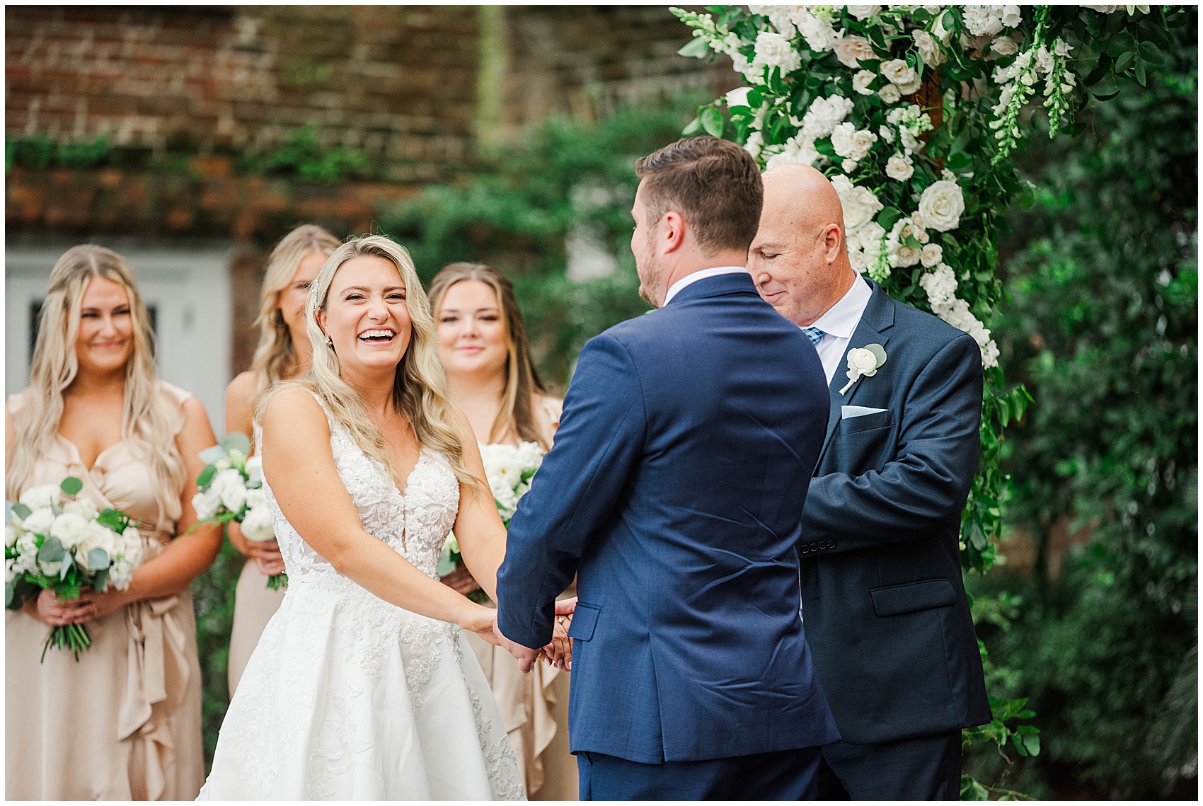 bride laughing during the vows at their Historic Rice mill wedding venue