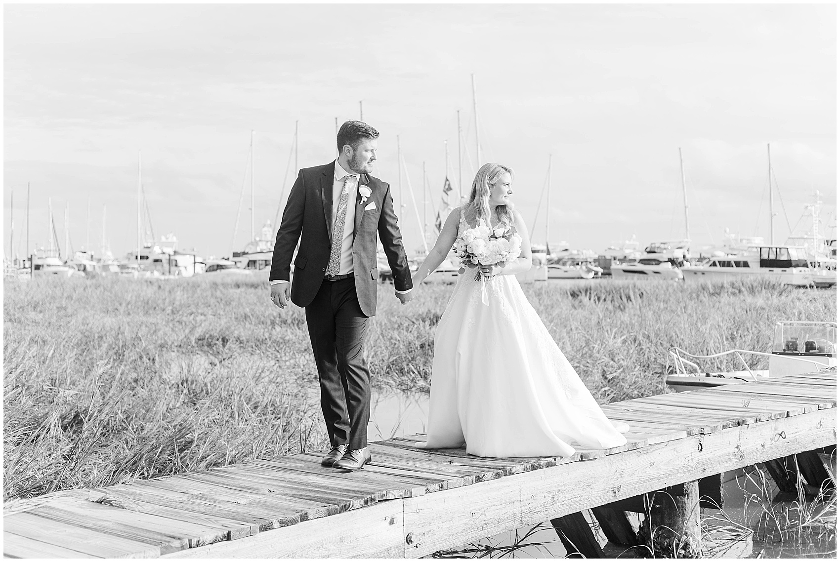 bride and groom walking along a dock near the Historic Rice mill wedding venue